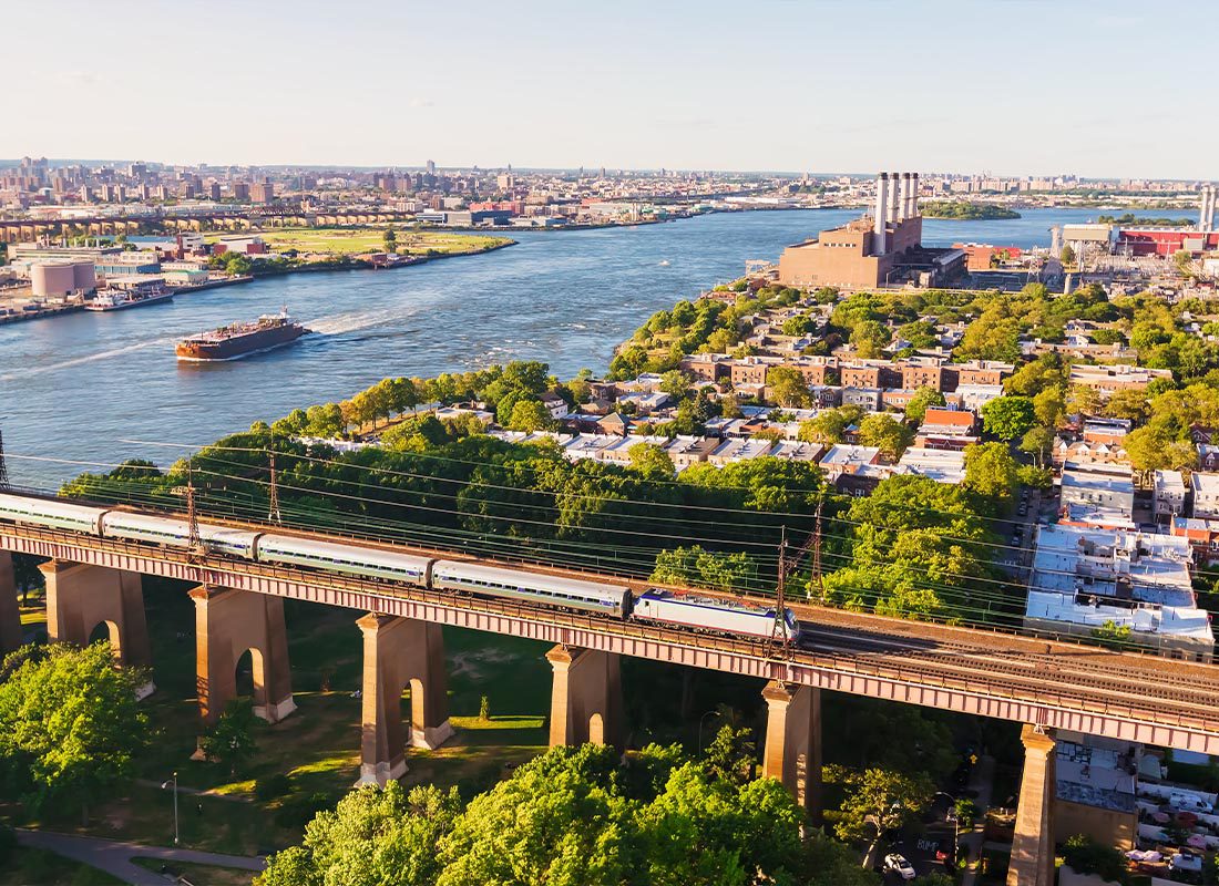Contact - Aerial View of the Hell Gate Bridge Over the East River in NY